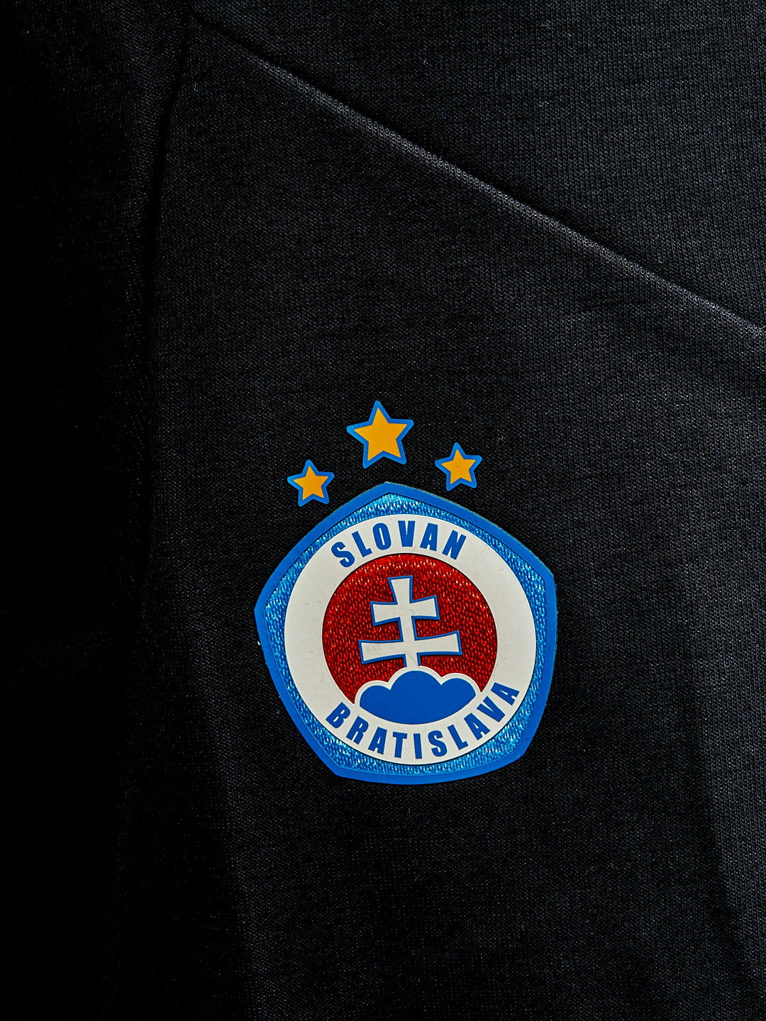 Adidas men's black shorts with a colorful logo